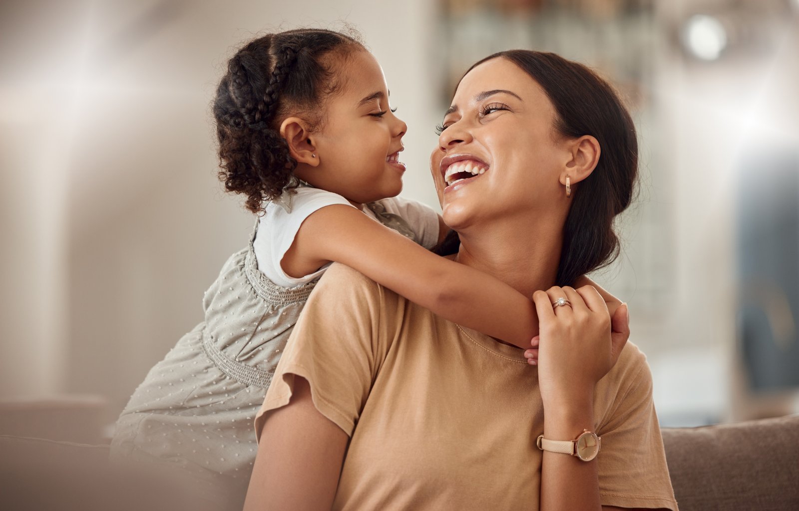 A parent and child at home, representing the everyday spending decisions the envelope system is built to control