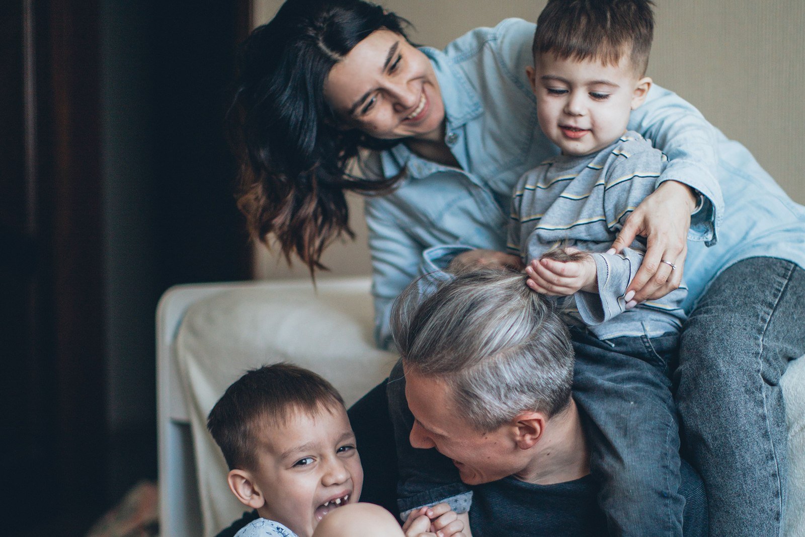 A family at home, representing the everyday tradeoffs behind freeing up money for debt payoff